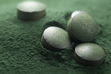 Close up of Atisanal Spirulina Tablets and Powder