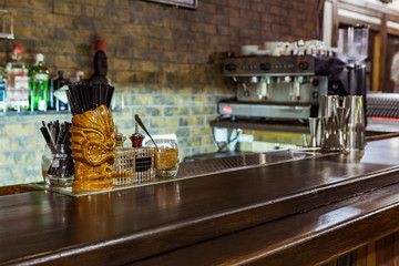 a glass tiki on the bar
