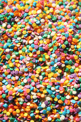 Fototapeta na wymiar Colorful candy sprinkles isolated on white background 