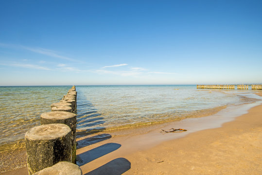 groins in the Baltic Sea with blue sky