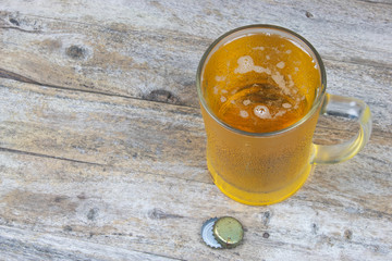 cold beer on the table wood background
