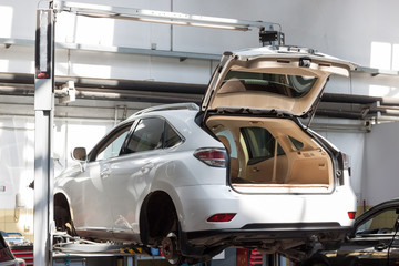 Scheduled replacement and wheel alignment in workshop car.