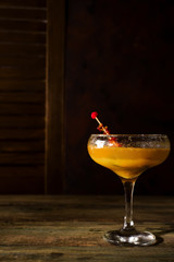 Frozen cocktail smoothie Margarita on a dark wooden background