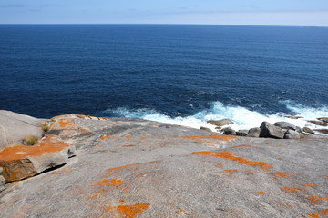 sky and mountain rock on the ocean