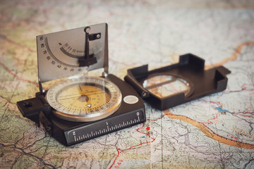 Old compass on a map