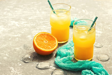 Orange juice in a glass, blue napkin. Selective choice. The concept of summer. Toned photo