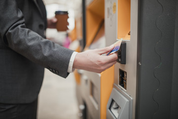 Paying for the Train Ticket © dglimages