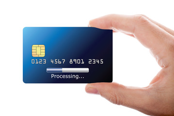 Hand holding credit card with processing bar on it, isolated on white background