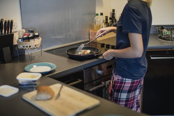 She's Making an Egg Sandwich for Breakfast