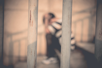 Men desperate to catch the iron prison,prisoner concept,thailand people,Hope to be free,A person...