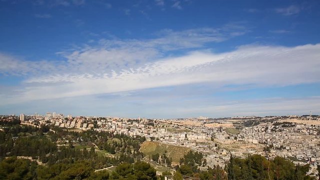 Tranquil scene as white clouds moving in majestic heaven over panorama of old city Jerusalem