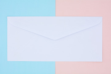 white envelope mail on pink and blue background