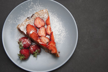 Strawberry Tart Piece. homemade Fruit Berry Cake Tart Pie with Strawberries. Black Board.