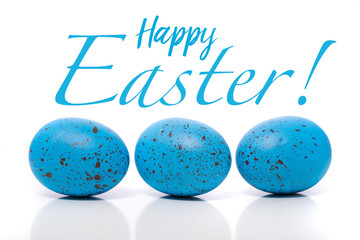 A group of blue Easter Eggs with speckles on a white background