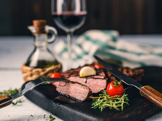 Steak and vine on white background