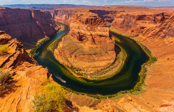 Horseshoe Bend in summer sunny day, formation in Colorado River.