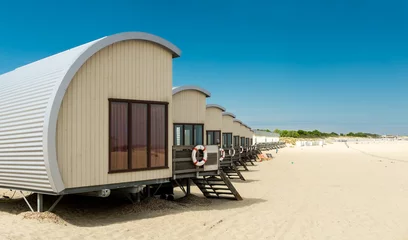 Foto op Plexiglas Row of Holiday houses on the beach of Vrouwenpolder, the Netherlands © Erik_AJV