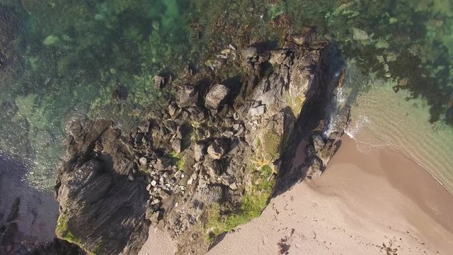 Blue Ocean Waves Crashing over Rocks, Aerial Drone Footage