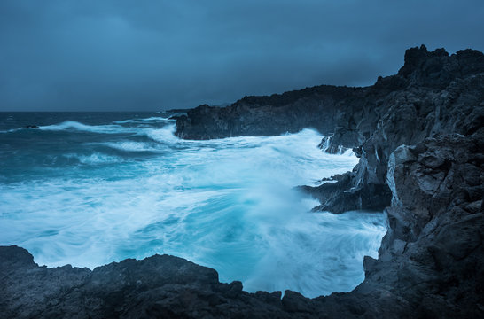 Scenic view of cliffs in Los Hervideros at night