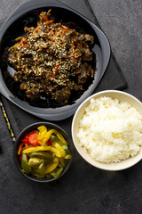 Roasted beef in sauce with spices and sesame seeds in Asian style. Mongolian meat.