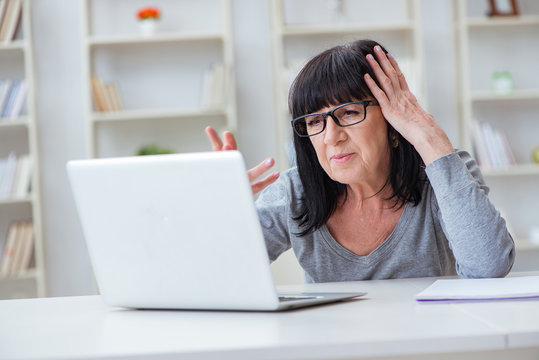 Senior Woman Struggling At Computer