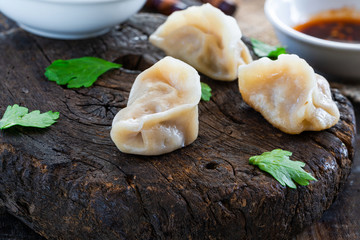 Chinese pork dumplings - dim sum - with sweet chili dipping sauce
