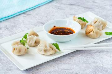 Chinese pork dumplings - dim sum - with sweet chili dipping sauce