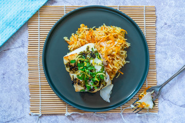 Grilled coriander and lemon cod with carrot pilaf - top view