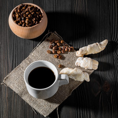 a cup of americano coffee on wood texture, still llife photography