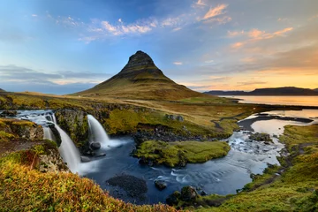 Wall murals Kirkjufell Amazing Icelandic landscape at the top of Kirkjufellsfoss waterfall with Kirkjufell mountain in the background on the north coast of Iceland Snaefellsnes peninsula
