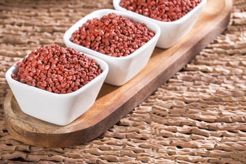 Annatto seeds in the bowls - bixa orellana