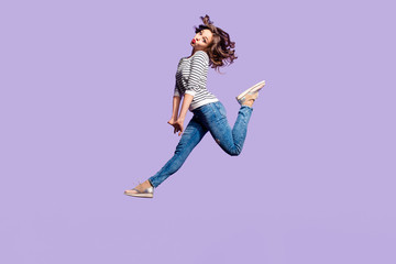 Portrait of lovely foolish girlfriend jumping in the air blowing sending kiss with pout lips having...