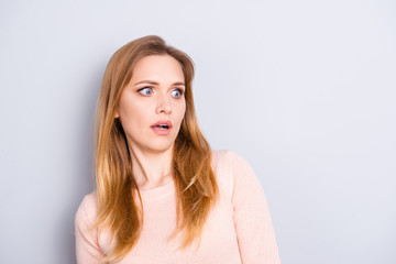 Obraz premium Staring eyes unbelievable people person concept. Close up portrait of pretty woman with big eyes looking aside on empty blank place near shoulder dressed in casual clothes isolated gray background