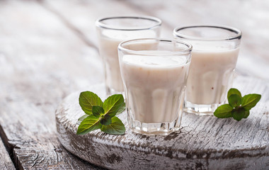 Greek yogurt on light wooden table