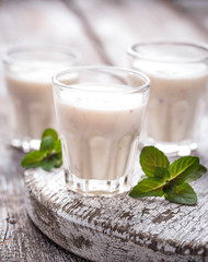 Greek yogurt on light wooden table