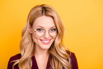 Head shot portrait of cheerful nice woman with white beaming smile in glasses looking at camera...