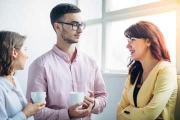Colleagues chatting at office