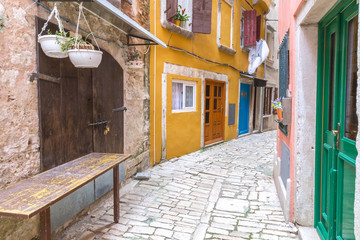 Fototapeta na wymiar Street with colorful facade of an old houses in Rovinj, Croatia, Europe.