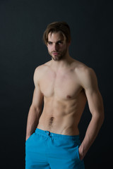 Man with six pack and ab muscles. Sportsman with sexy torso and chest. Athlete with fit body in...