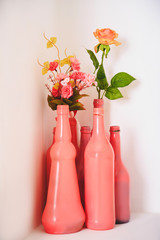 art decor white pink design, dried flowers in colored bottles and jars