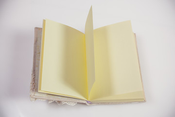 Tender notebook, open, on white background