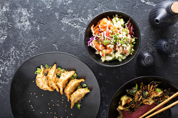 Asian cuisine dishes on the table overhead view