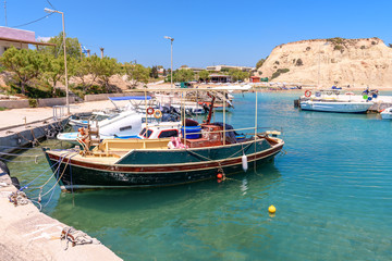 Fototapeta na wymiar Fishing boats moored In Kolymbia harbor. Rhodes island. Greece