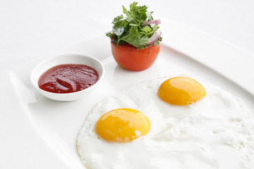 Sunny side up eggs served in the restoraunt for breakfast