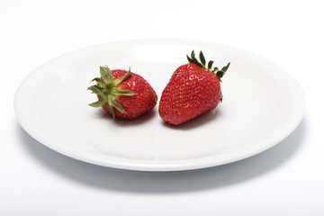 the whole strawberry on a plate