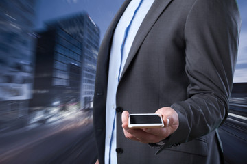 Businessman on city background