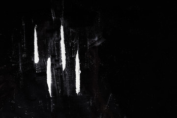 cocaine roads on a black table - obrazy, fototapety, plakaty