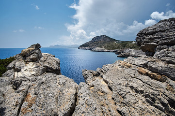 rocky cliff on the seacoast island of Rhodes.
