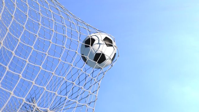 Soccer ball flying to goal