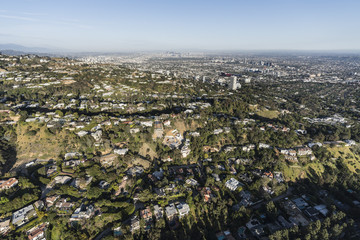 Aerial view of hillside and canyon homes above Beverly Hills and West Hollywood in Los Angeles California.  